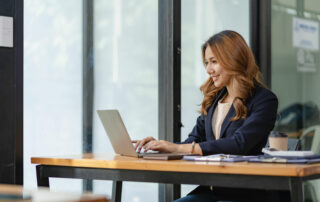 Woman calculating how much she can afford to invest in a franchise business.